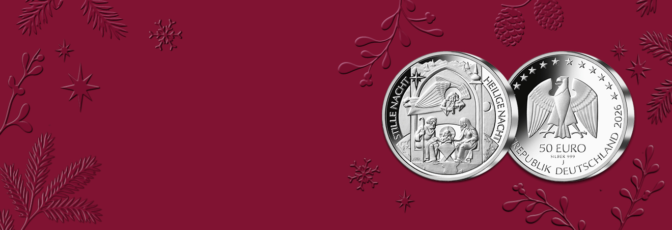 50-Euro-Silbermünze „Heilige Nacht“ vor weihnachtlichem rotem Hintergrund