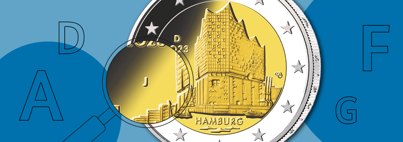 Grafik mit einer 2-Euro-Sammlermünze „Hamburg“ und Fokus auf das Münzzeichen „J“