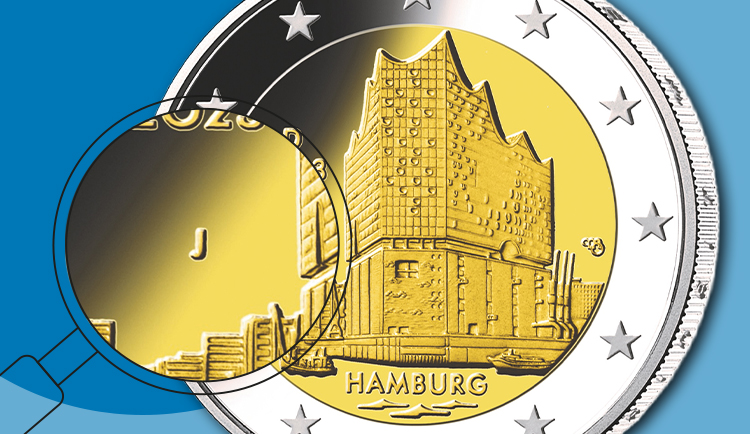 Grafik mit einer 2-Euro-Sammlermünze „Hamburg“ und Fokus auf das Münzzeichen „J“.